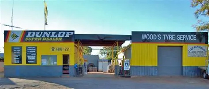 Lake Cargelligo Taxi Truck depot at Wood’s Tyre Service with Dunlop Super Dealer signage.